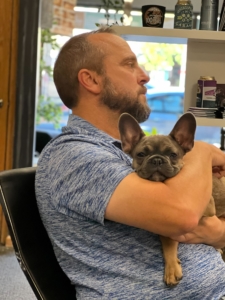 VantagePoint Marketing - Eric holding puppy Pepper during meeting