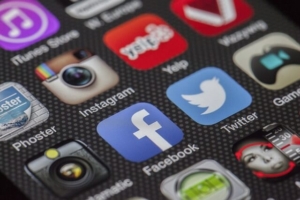 Social Media - Phone with social media platform icons