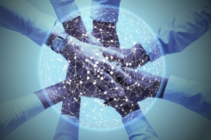 collaborate- several connected hands with digital connections